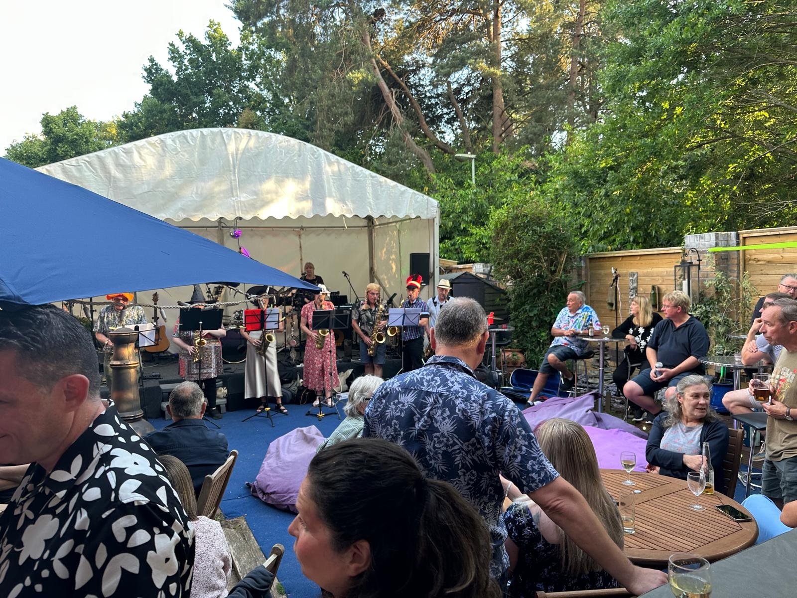 Guests enjoying live music and pizza at a private party