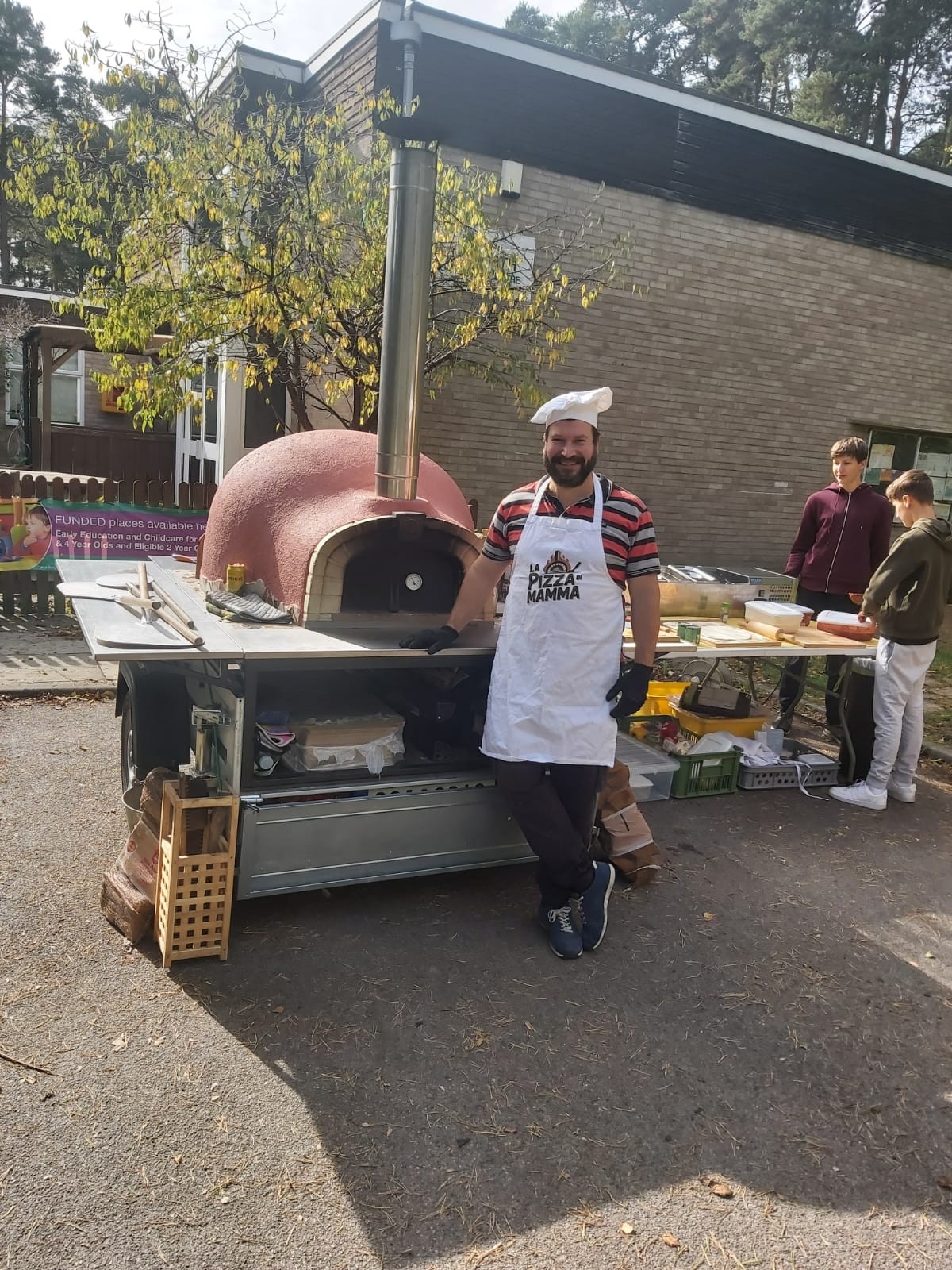 Wood-fired pizza oven at private party